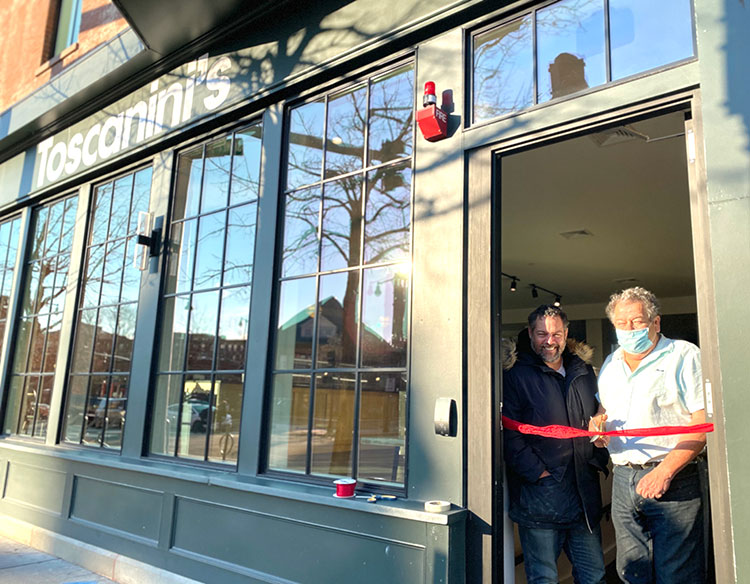 Patrick Barrett and Gus Rancatore cut the ribbon